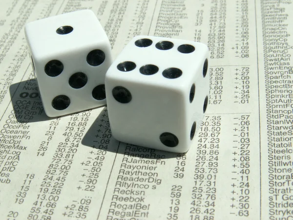 White dice on stock report — Stock Photo, Image