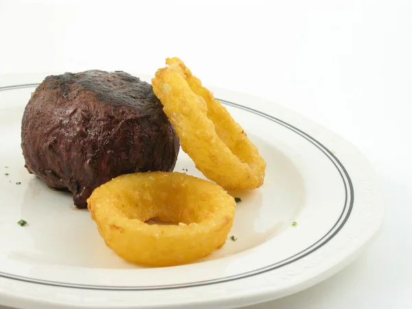 Steak and onion rings — Stock Photo, Image
