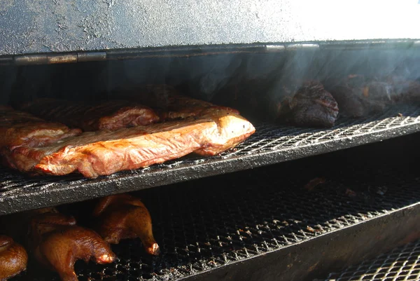 Meat in the smoker — Stock Photo, Image