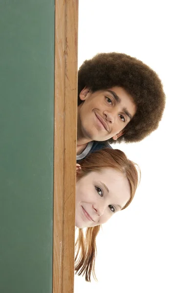 Lächelnde Teenager mit leerer Tafel — Stockfoto