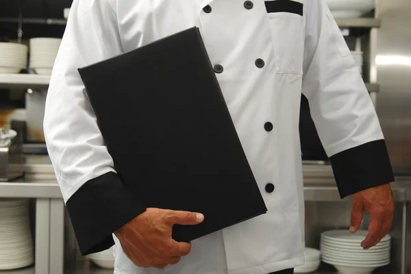 Šéfkuchař s menu — Stock fotografie