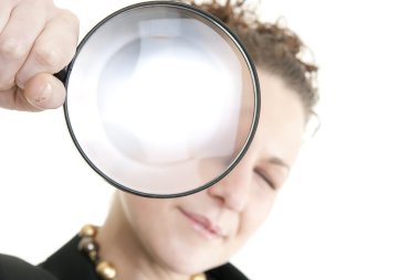 Woman holding a magnifying glass clipart
