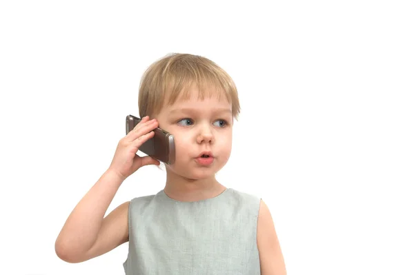 The little girl speaking by mobile phone — Stock Photo, Image