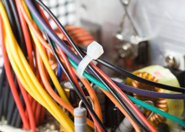 Macro detail of inductor with red wire clipart