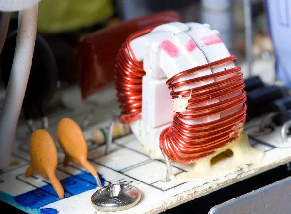 Macro detail of inductor with red wire — Stock Photo, Image