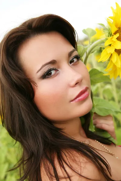 Woman with sunflowers — Stock Photo, Image