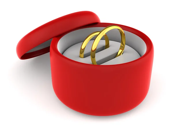 Anéis de casamento em caixa de presente redonda vermelha — Fotografia de Stock