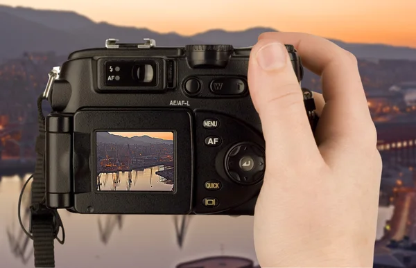 Digital Camera photo in a hand isolated — Stock Photo, Image