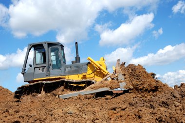 Bulldozer in action clipart