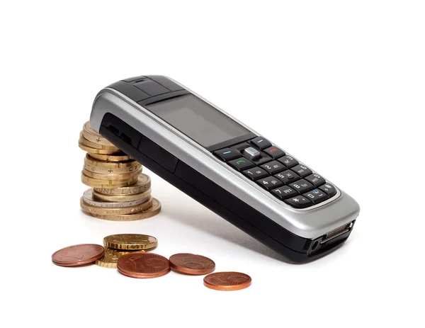 Mobilní telefon a peníze (izolovaná) — Stock fotografie