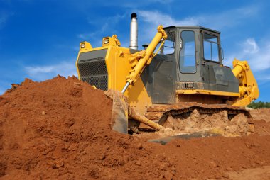 Close view of heavy bulldozer moving san clipart