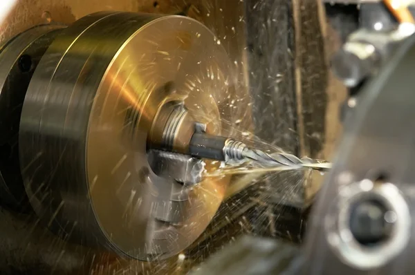Drilling a hole in blank on turning mach — Stock Photo, Image