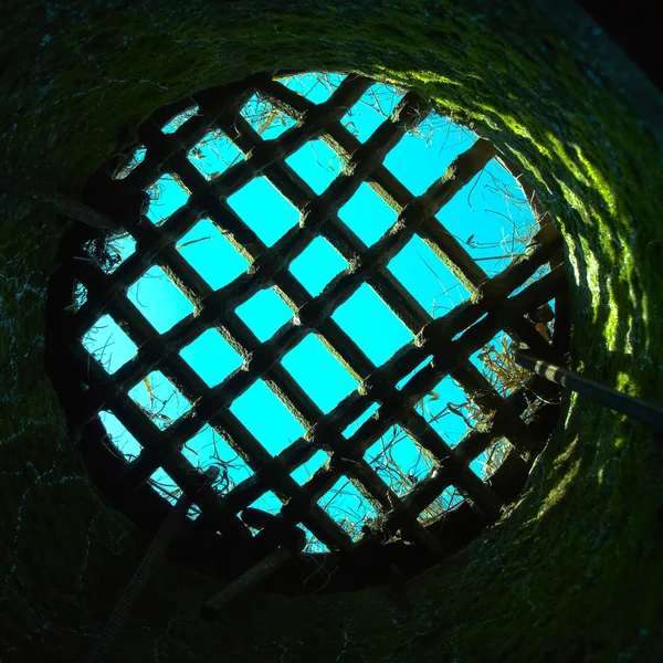 Round prison hole with grid — Stock Photo, Image
