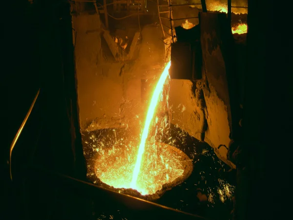 Liquid metal from casting ladle — Stock Photo, Image