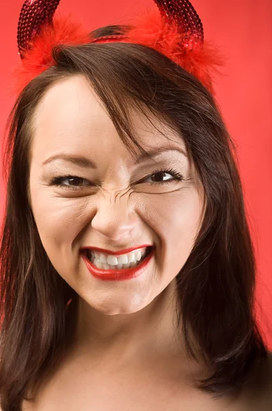 Young woman in devils horns — Stock Photo, Image