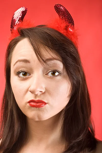 Young woman in devils horns — Stock Photo, Image