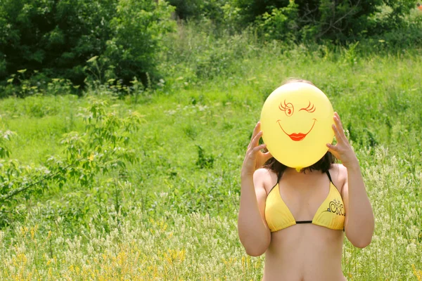 stock image The nice girl with a yellow balloon