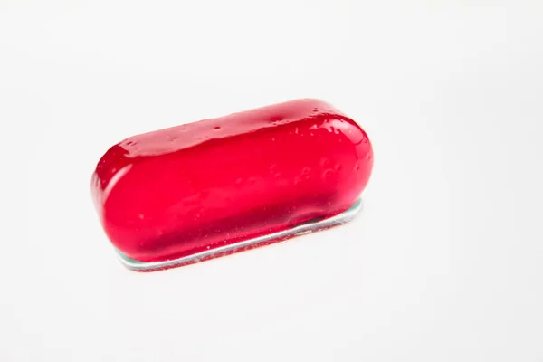 Red sugar candy removed on a white backg — Stock Photo, Image