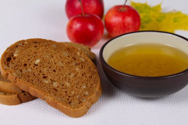 Black bread with honey and apples clipart