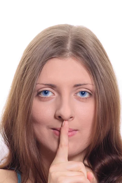 Menina com um indicador pressionado nos lábios — Fotografia de Stock