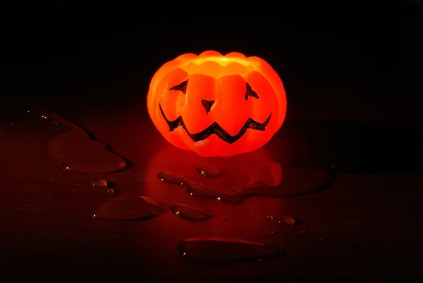 Halloween candle with water drops — Stock Photo, Image