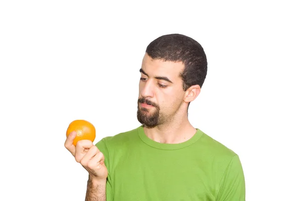 Homem comendo uma laranja — Fotografia de Stock