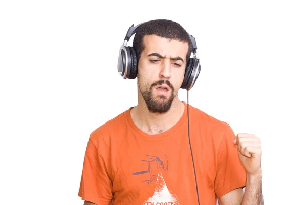 Jonge man luisteren muziek met hoofdtelefoon — Stockfoto