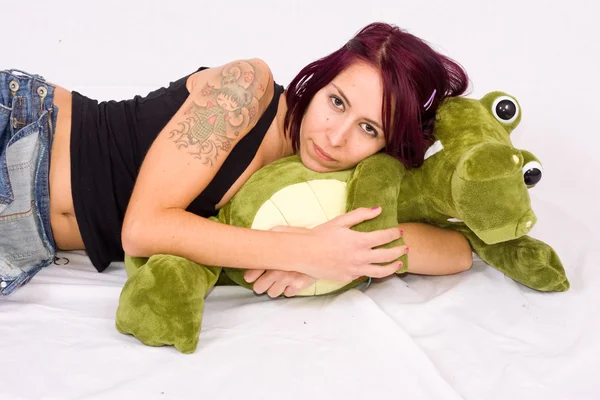 Young woman playing with peluche — Stock Photo, Image