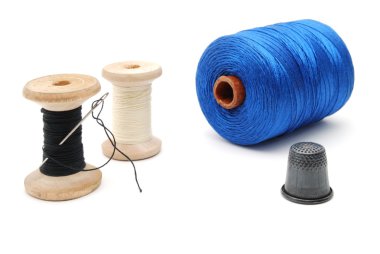 Three coils threads and a thimble clipart