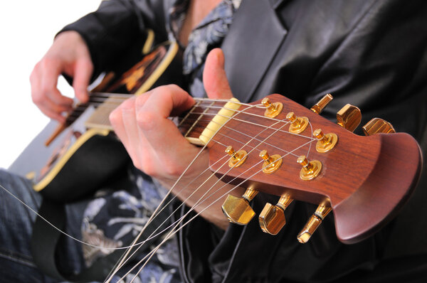 Musician plays his acoustic guitar