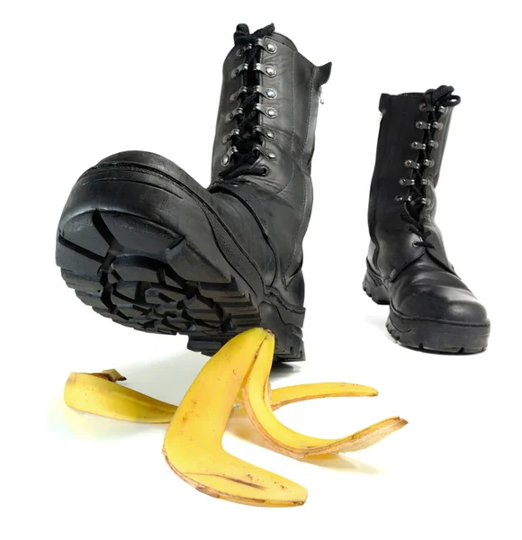Banana peel and shoe — Stock Photo, Image