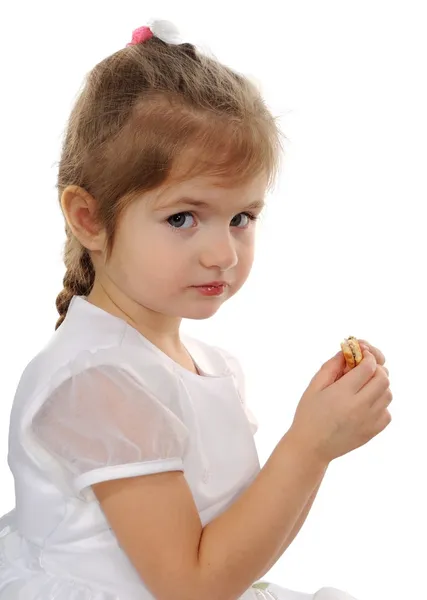 The girl eats cookies — Stock Photo, Image
