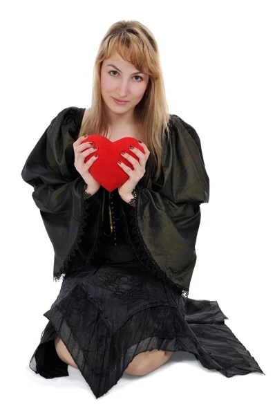 Blondine mit Herz in der Hand — Stockfoto