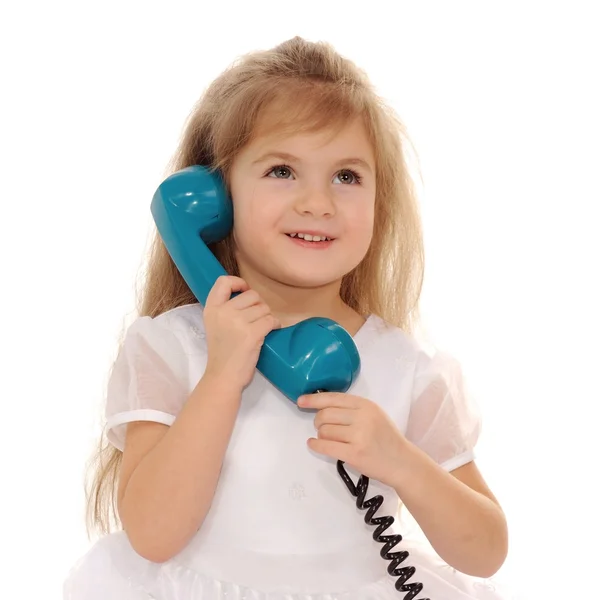 The girl with a handset. — Stock Photo, Image