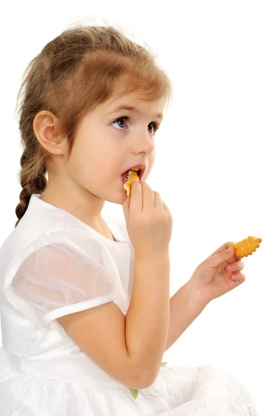 The girl eats cookies — Stock Photo, Image