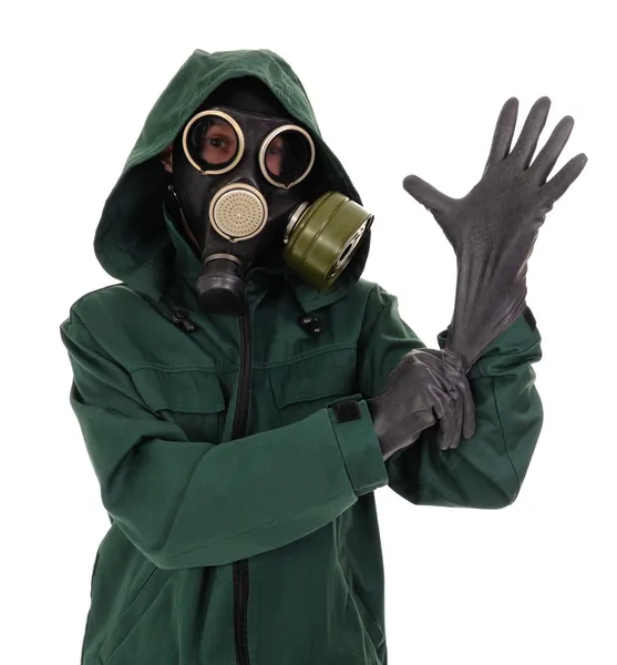 Gas mask, gloves, the person — Stock Photo, Image