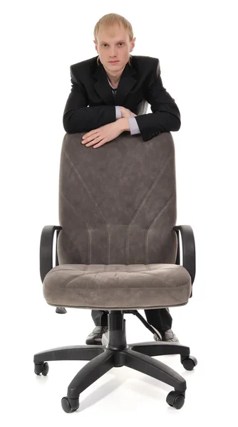 Человек и кресло — стоковое фото