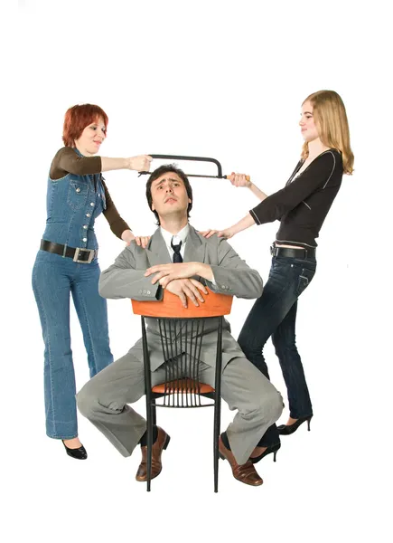 Two women dividing a man — Stock Photo, Image