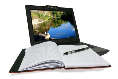 Laptop and notebooke on white background clipart