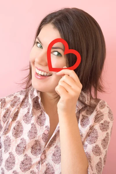 Smiling girl with heart — Stock Photo, Image