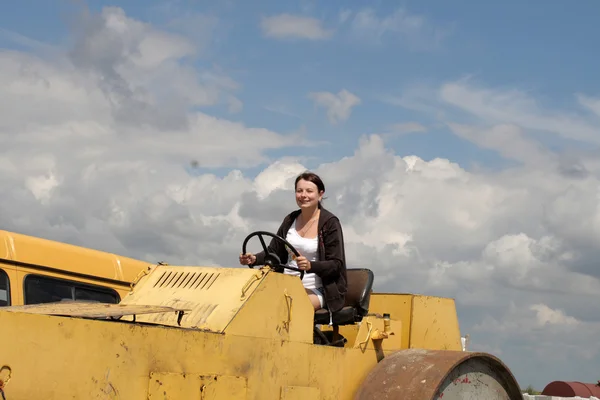 Girl on road-roller — Stock Photo, Image