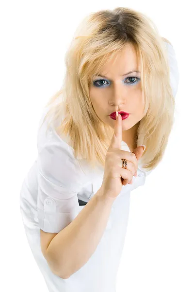 Geheim. vrouw toont hush, op witte backg — Stockfoto
