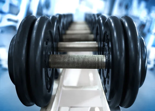 stock image Dumbbell on blue background