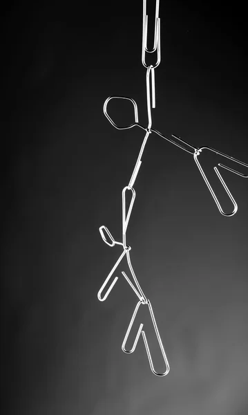 A paper clip man hanging — Stock Photo, Image