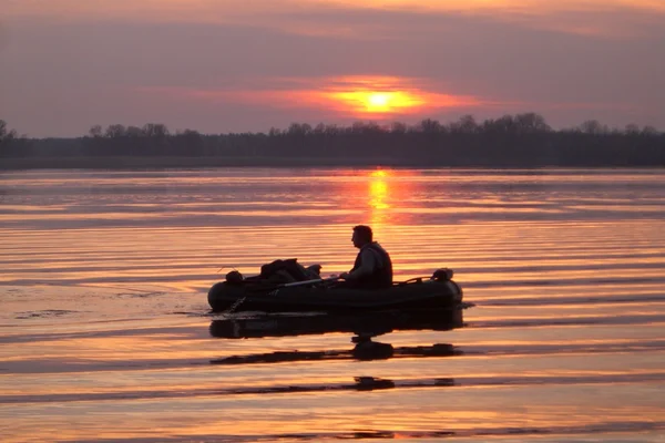 Pesca ao pôr do sol Fotografias De Stock Royalty-Free