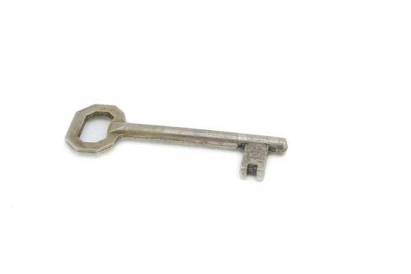 stock image An old silver key isolated on white back