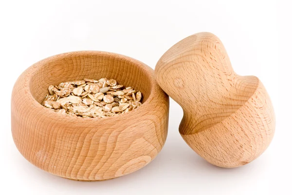 Mortar and Pestle whit oats flakes — Stock Photo, Image
