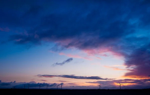 Wind turbines and dramatic sky — Stock Photo, Image
