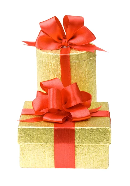 Two gold gift boxes with red ribbons — Stock Photo, Image