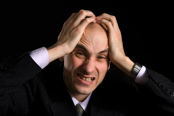 Ein Mann mit sehr schmerzhaften Kopfschmerzen — Stockfoto